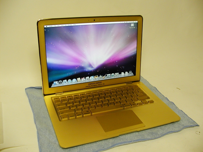Illustration for article titled Gold MacBook Air Has Bejeweled Rainbow Apple